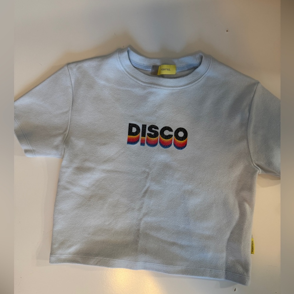 Color- Baby blue 
baby T-shirt says Disco
Size small